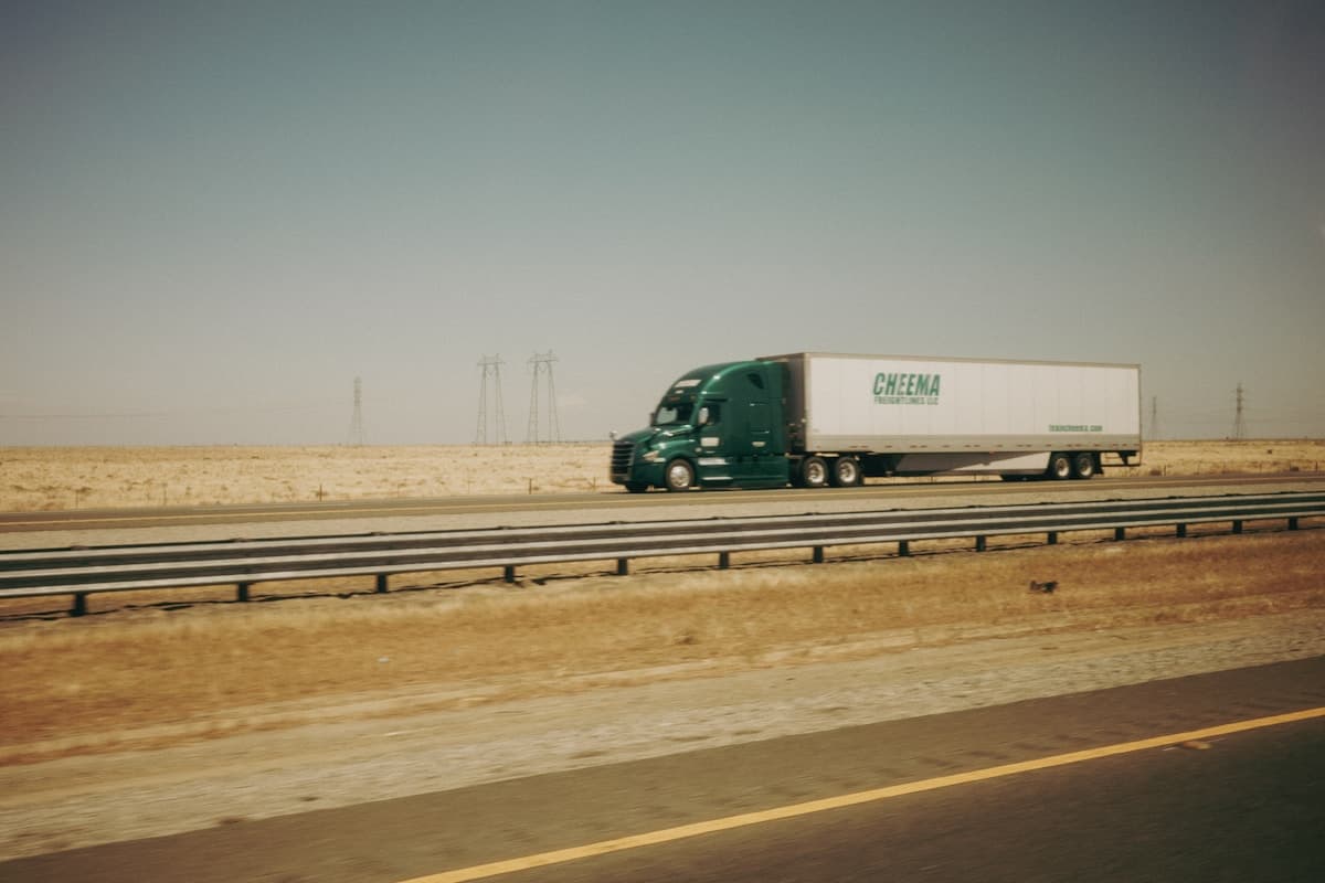 An articulated lorry travelling along an open highway.